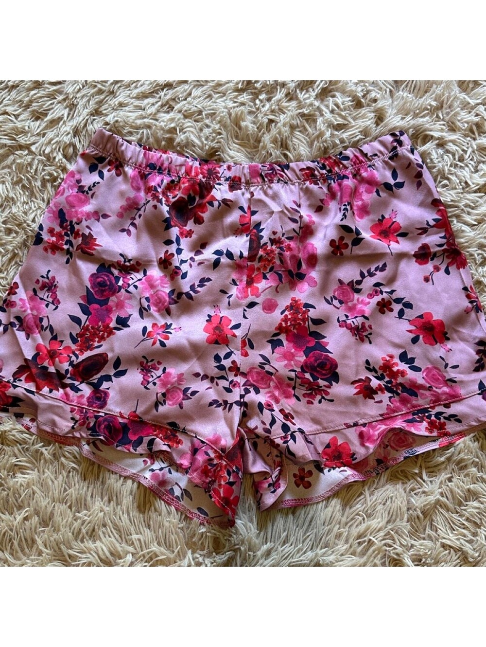 Pink floral satin sleep shorts with red, pink, and dark blue flowers, size M